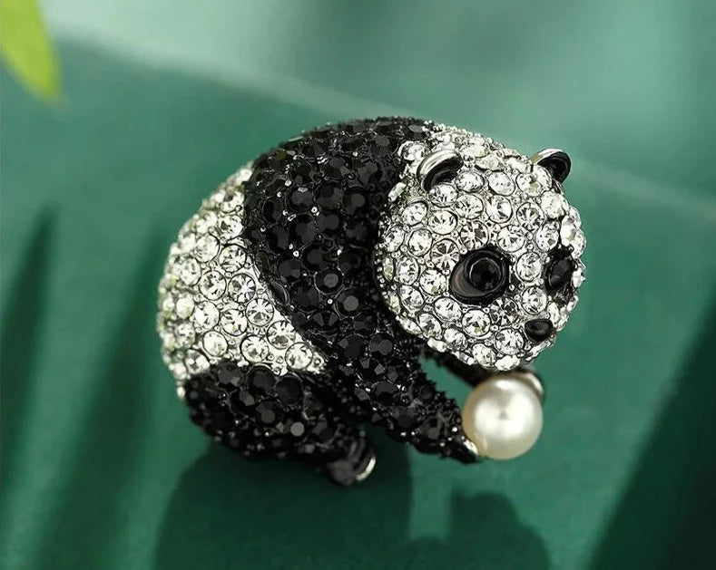 Crystal Panda Enamel Charm Brooch--- This playful accessory, adorned with shimmering crystals and pearls, adds charm to any occasion.